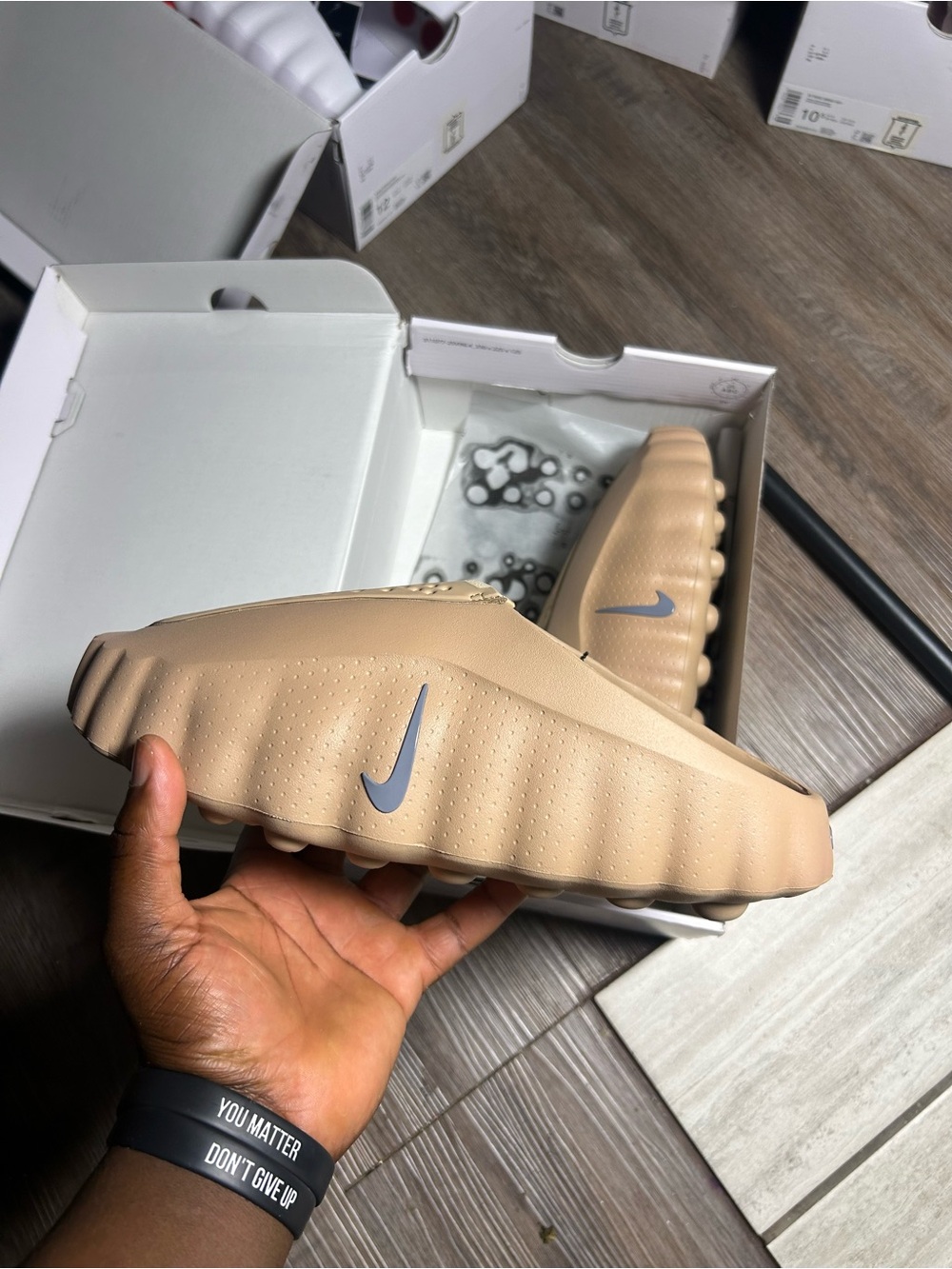 Nike Kids Slide Sandal in Beige with Gray Swoosh
